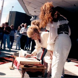 Mae Boren Axton casts her hand prints and signature in concrete at the McSwain Theatre, October 16, 1993. These impressions are still in the sidewalk today. 