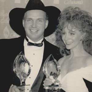 Garth Brooks and Reba McEntire hold their People's Choice Awards on March 8, 1994 in Culver City, California. Brooks won for Male Musical Performer and McEntire for Female Country Musical Performer. 