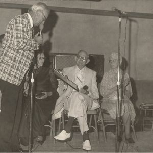 Albert Brumley (seated, center) and his wife Goldie attend a homecoming event in Spiro, Oklahoma in 1975