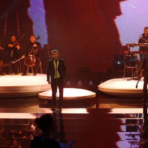 Ryan Tedder, center,  and OneRepublic performing live at the City Hall of Vienna, March 23, 2013.