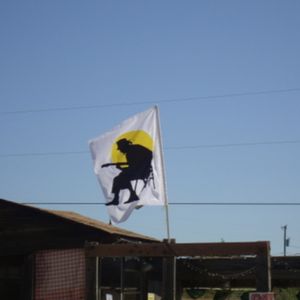 Flag flying over the Oklahoma Blues Hall of Fame in Rentiesville to honor D.C. Minner.