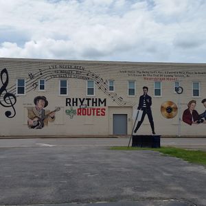 This mural in the town of Duncan where Hoyt Axton and his mother Mae Boren Axton once lived pays tribute to the country music stars. It includes lyrics from one of Hoyt's most famous songs and Mae Boren's hit she wrote for Elvis.