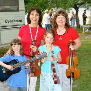 Jana with her daughter and granddaughters at Snider's Camp during the 2011 American Heritage Music Festival in Grove, Oklahoma

Left to right, top: Jana Jae and her daughter Sydni; bottom: Jana's granddaughters Robyn and Sandra
