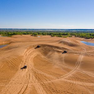 Adrenaline junkies flock to Little Sahara State Park's dunes for outdoor adventures. Photo by Shane Bevel.