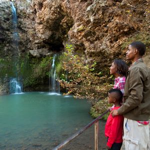 Viewing platforms that stretch out over the water give an up-close view of the gorgeous waterfall at Natural Falls State Park.