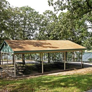 Gather with your group at the shaded picnic shelter with a lake view.