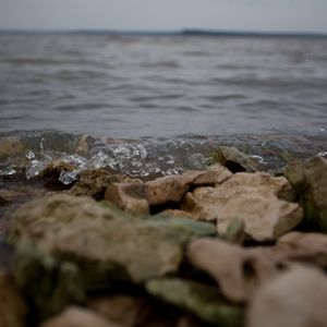Gentle waves crash across the rocks at Hugo Lake State Park. Photo by Rebekah Workman.