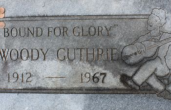 A memorial marker for Woody Guthrie, who is not actually buried here, at Highland Cemetery in Okemah.