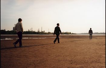 The Hanson brothers walk along the Arkansas River in Tulsa during a 2007 photo shoot for "The Walk," their fourth studio album. 