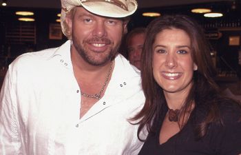 Kellie Coffey pictured with Toby Keith in 2003