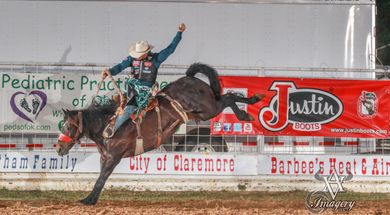 Bronc action at the Will Rogers Stampede PRCA Rodeo