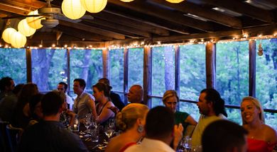 Congregate around the communal table at Living Kitchen Farm & Dairy in Depew. Photo by Laci Schwoegler/Retrospec Films.