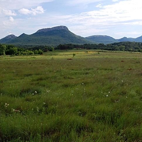 A rugged Western landscape welcomes visitors to the Wichita Mountains Wildlife Refuge.