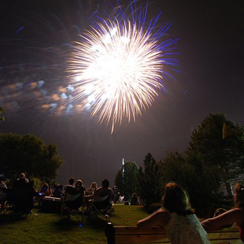Fireworks light up the night as spectators gaze skyward in Edmond during the LibertyFest Fourth of July celebration.  This show, held on the campus of the University of Central Oklahoma, is one of the biggest in the state.