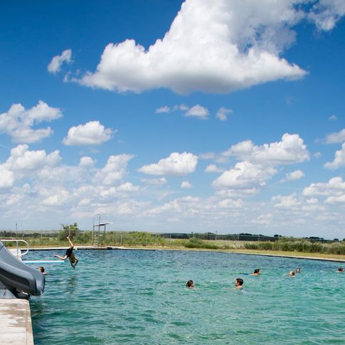Gage Artesian Beach is a natural swimming area with cement sides like a pool and a sandy bottom like a lake.