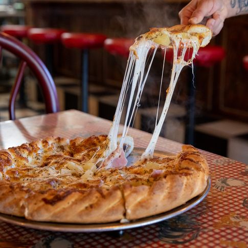 Each specialty pie at Sam & Ella's Chicken Palace in Tahlequah is served on hand-rolled, stone-baked crust.