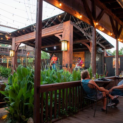 Enjoy dinner and drinks on a spacious patio with occasional live music at Abendigo's in Broken Bow.