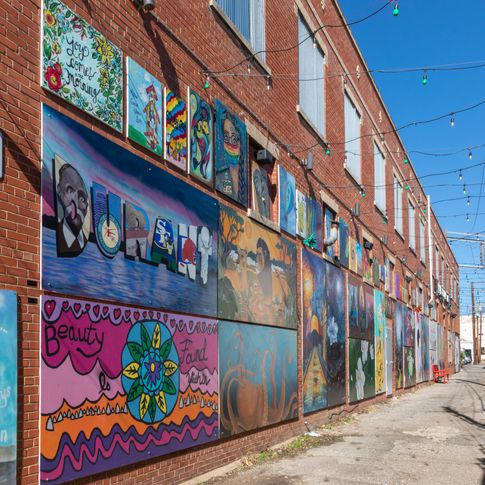 Take a walk through a vibrant outdoor gallery when you visit the Magnolia Mile Art Alley in Durant.