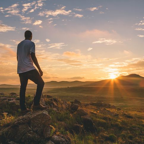 A hiker surveys the landscape at the Wichita Mountains Wildlife Refuge in southwest Oklahoma.