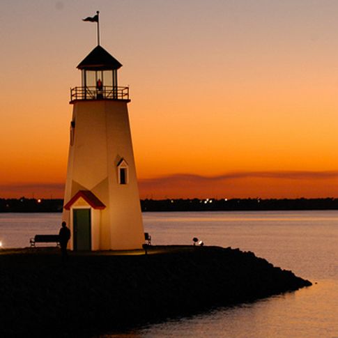 The Lake Hefner lighthouse in Oklahoma City seems to glow in the brilliant sunset.