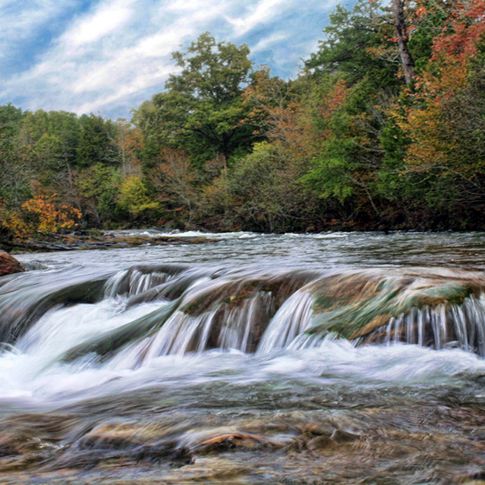 The Mountain Fork River in Beavers Bend State Park offers incredible scenery like this area where the water cascades over the rocky river bottom.  Several canoe outfitters offer rentals and float trips on the Mountain Fork River.