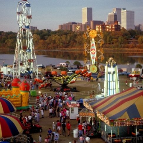 The Tulsa skyline rises in the background of the Tulsa Oktoberfest celebration.