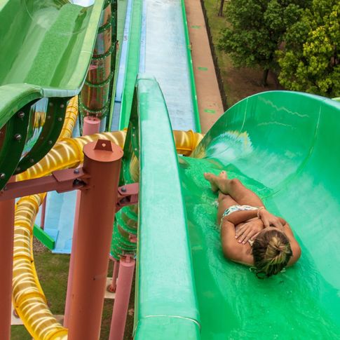 Feel the thrill of rushing down colorful slides at Safari Joe's H20 Water & Adventure Park in Tulsa.