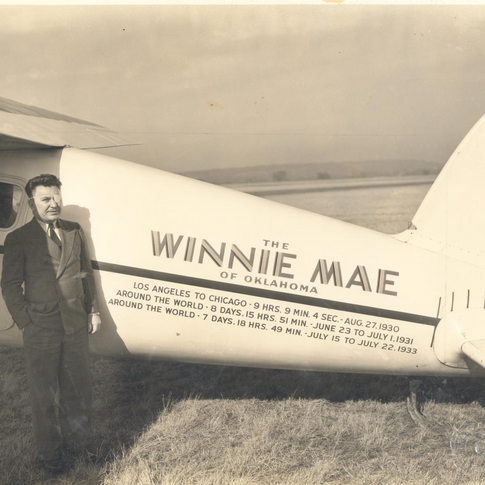 Wiley Post poses next to the Winnie Mae in Bartlesville, Oklahoma in 1934.