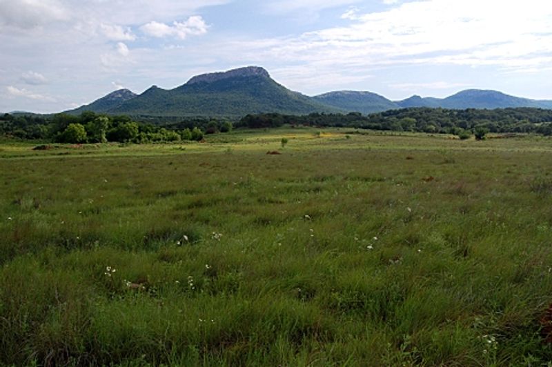 A rugged Western landscape welcomes visitors to the Wichita Mountains Wildlife Refuge.