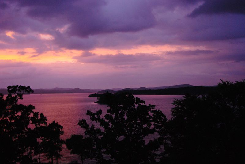 A romantic sunrise over Broken Bow Lake near Beavers Bend State Park.