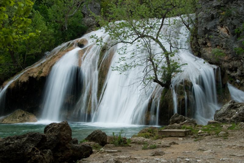 The 77-foot tall cascades at Turner Falls Park in Davis are a favorite outdoor spot. A natural swimming pool is formed at the base of the picturesque falls where families can enjoy the cool waters and scramble around the rock formations.