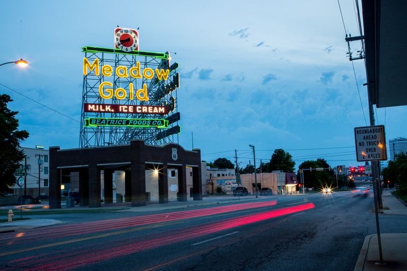 The circa-1939 Meadow Gold sign in Tulsa lights up the sky along Route 66.