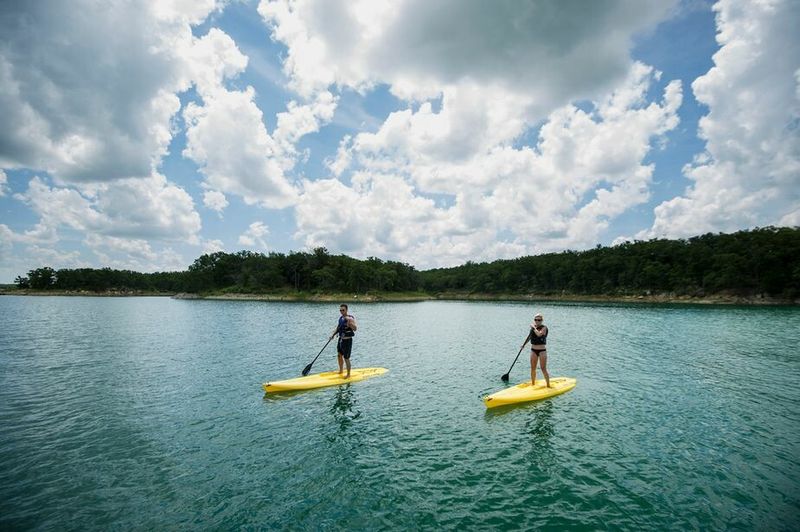 Paddleboarding on the waters at Lake Murray State Park.