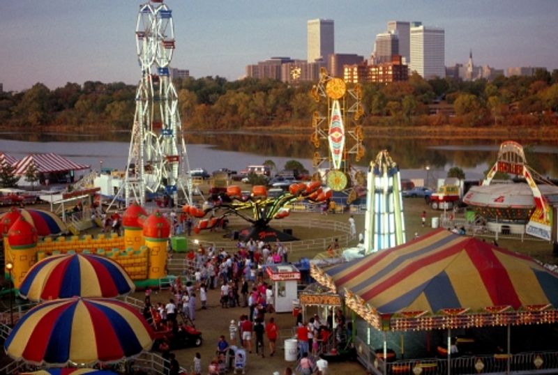 The Tulsa skyline rises in the background of the Tulsa Oktoberfest celebration.