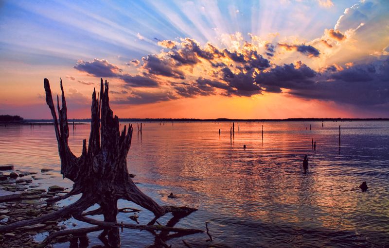 A dramatic sunset turns a Lake Eufaula cove into a dazzling waterscape.