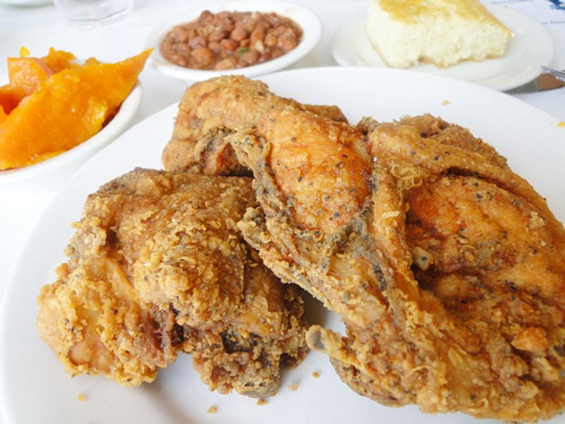 Evelyn's Soul Food in Tulsa features delicious fried chicken alongside famous sides like collard greens, sweet yams and macaroni and cheese.