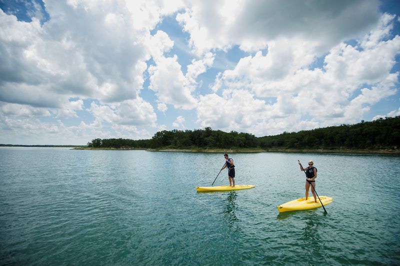 Stand up paddleboarding is a fun way to get around on the water and see unique views of the shoreline and blue waters of Lake Murray.