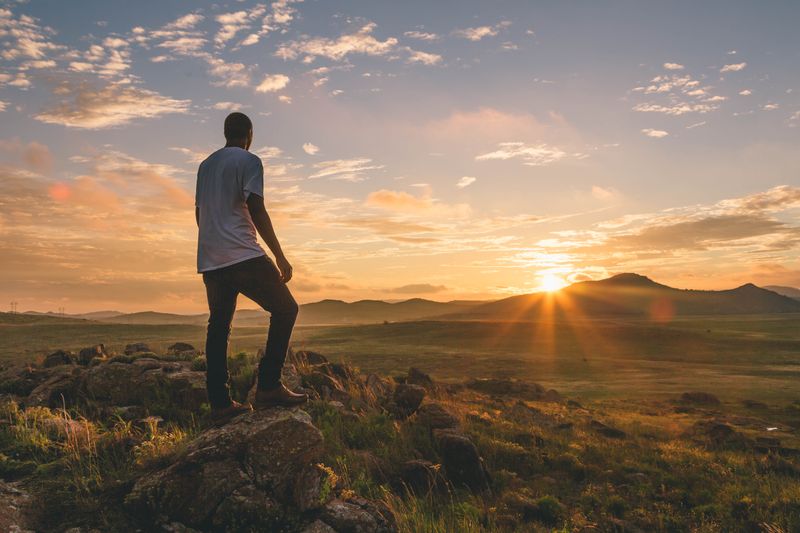 A hiker surveys the landscape at the Wichita Mountains Wildlife Refuge in southwest Oklahoma.
