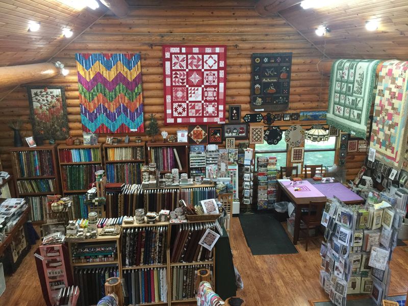 row by row experience log cabin quilt shop
