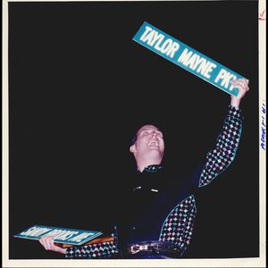 Garth Brooks holds up the souvenir "Taylor Mayne Parkway" street sign that the City of Yukon presented to him along with the actual Garth Brooks Boulevard sign.  Taylor Mayne was the name that he and wife Sandy were planning for their soon-to-be-born daughter.