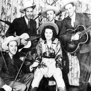 Patti Page and the "Oklahoma Outlaws" pose for a photo.