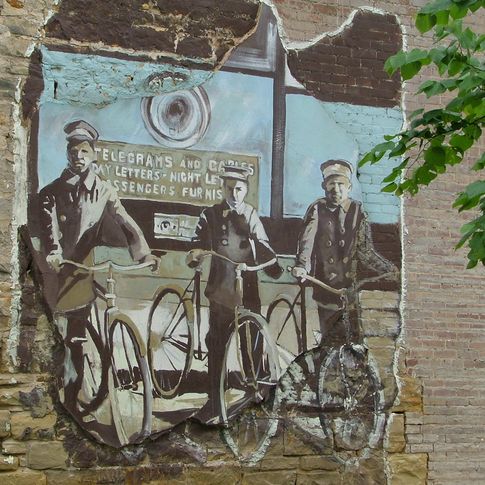 Palmer Studios added this Muskogee Postcard Mural to a local business building in 2001.