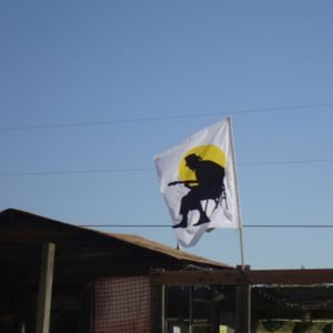 Flag flying over the Oklahoma Blues Hall of Fame in Rentiesville to honor D.C. Minner.