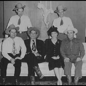 Bob Wills poses for a family portrait with his brothers and parents.