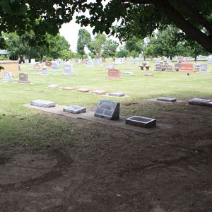 The Woody Guthrie family plot is located in Highland Cemetery in Okemah.
