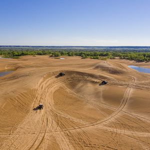 Adrenaline junkies flock to Little Sahara State Park's dunes for outdoor adventures. Photo by Shane Bevel.