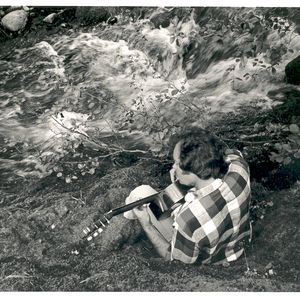 Mason Williams playing guitar beside Salt Creek in 1978