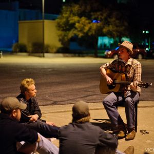 John Fullbright playing on the sidewalk in front of Frank & Lola's cafe in Bartlesville, Oklahoma in 2010. John had a new guitar and there were problems with the pickup, and it was too noisy in the bar for him to play without amplification. It was unseasonably warm that night, so guests went outside for this unplugged performance.