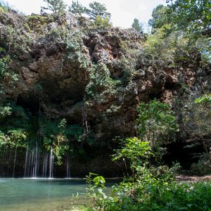 Explore Northeast Oklahoma's Natural Falls State Park to discover a stunning 77-ft waterfall and other hidden rock formations throughout this scenic region of the Ozark Highlands.