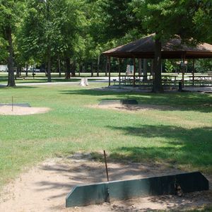 A recreational horseshoe pit adjacent to the group shelter.